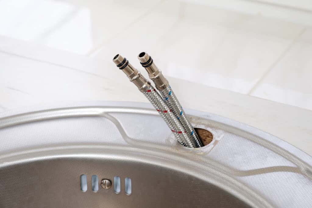 Two flexible water hoses for cold and hot water