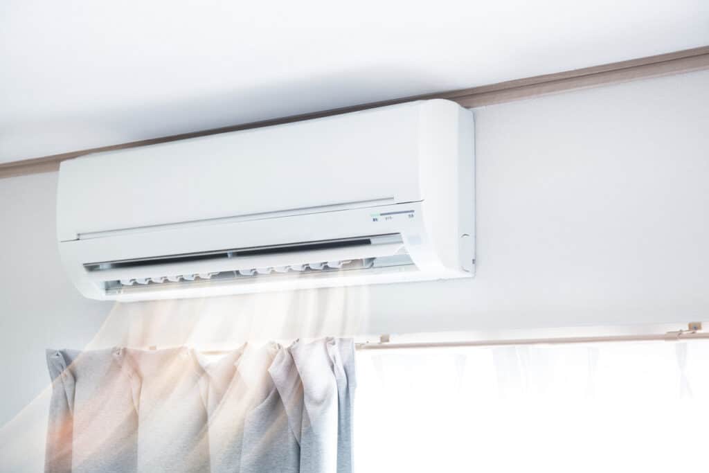 Air conditioner blowing warm air
